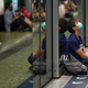 Protesters sit on a platform at Fortress Hill MTR station in Hong Kong, Aug. 5, 2019.
